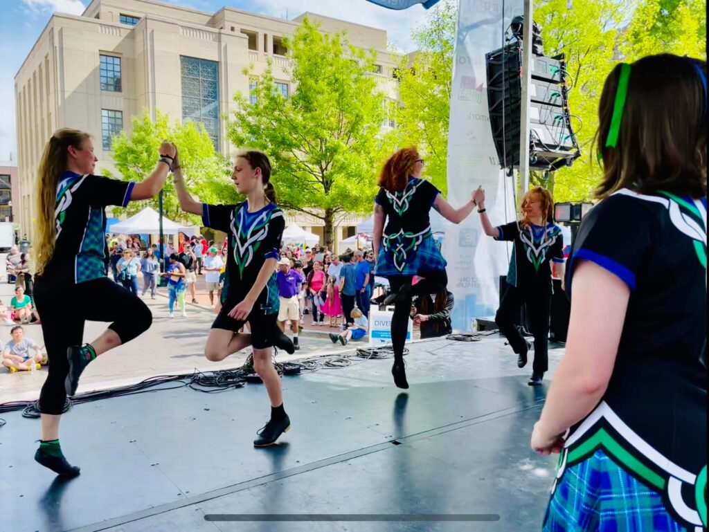 Bluegrass Ceili Academy students who take Irish dance classes in lexington perform at a local festival 