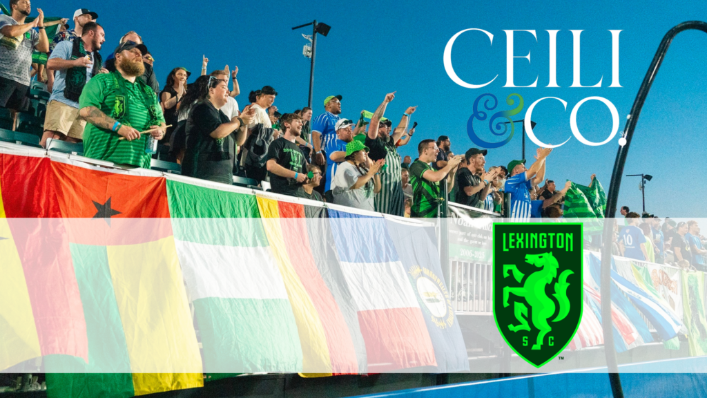 Graphic for a Ceili & Co. partnership with Lexington Sporting Club. The background shows a crowd of soccer fans cheering in stadium bleachers behind a row of international flags draped over the railing. The white "CEILI & CO." logo is in the upper right, and the green Lexington Sporting Club crest is in the lower right over a translucent white band.